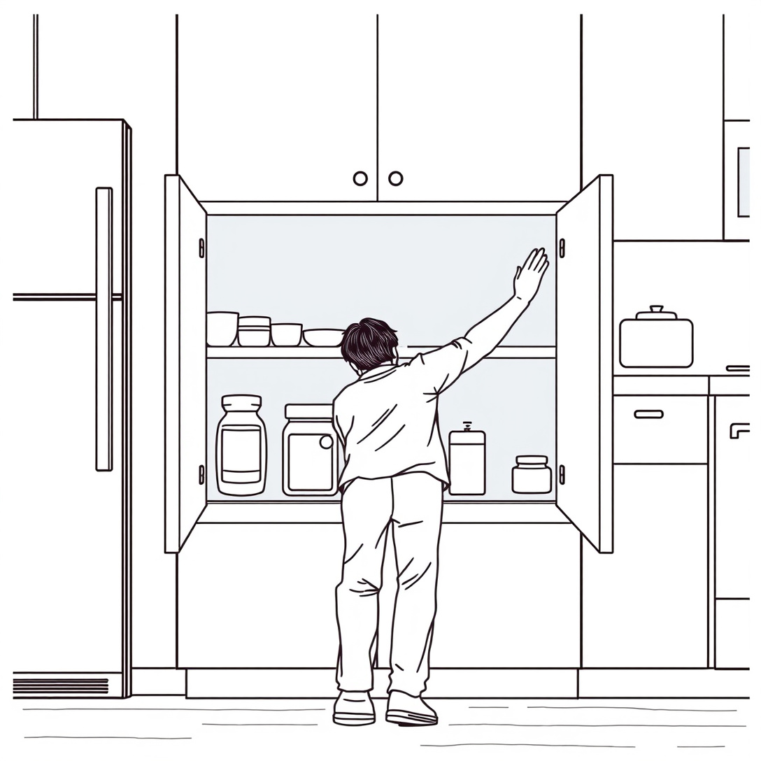 Person reaching deep into a base cabinet to retrieve stored items